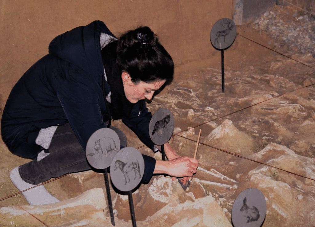 Dr. Angela Perri, Regional Vice President (International) at Chronicle Heritage and foremost expert on human-canine interactions, uncovers a dire wolf skeleton.