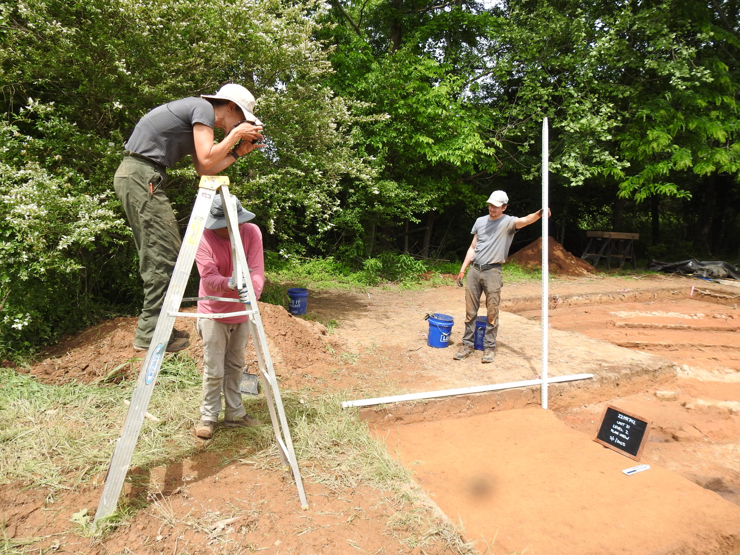 Stinchcomb takes a picture to document the site.