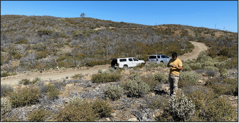 Dr. Brian Holguin, Senior Archaeologist at Chronicle, takes field notes along an access route in the Monument.