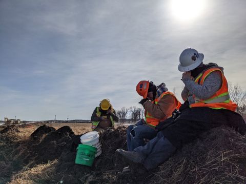 Dr. Luchsinger’s crew during downtime on a spoils pile in northern Minnesota in 2021 where the team was monitoring pipeline construction. “Since we had some time to spare, I handed out all my lighted hand lenses and explained how to begin analysis of sediments in the field,” Dr. Luchsinger said.