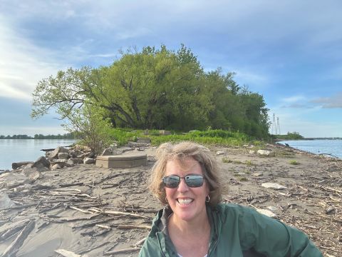 On her drive back from the SAAs in 2025 in Denver, Dr. Luchsinger stopped at the confluence of the Missouri and Mississippi rivers just north of St. Louis. “The Missouri River is over my right shoulder and the Mississippi River is over my left shoulder. I find confluences fascinating both for the archaeology and the geomorphology, where both are highly complex,” she said.